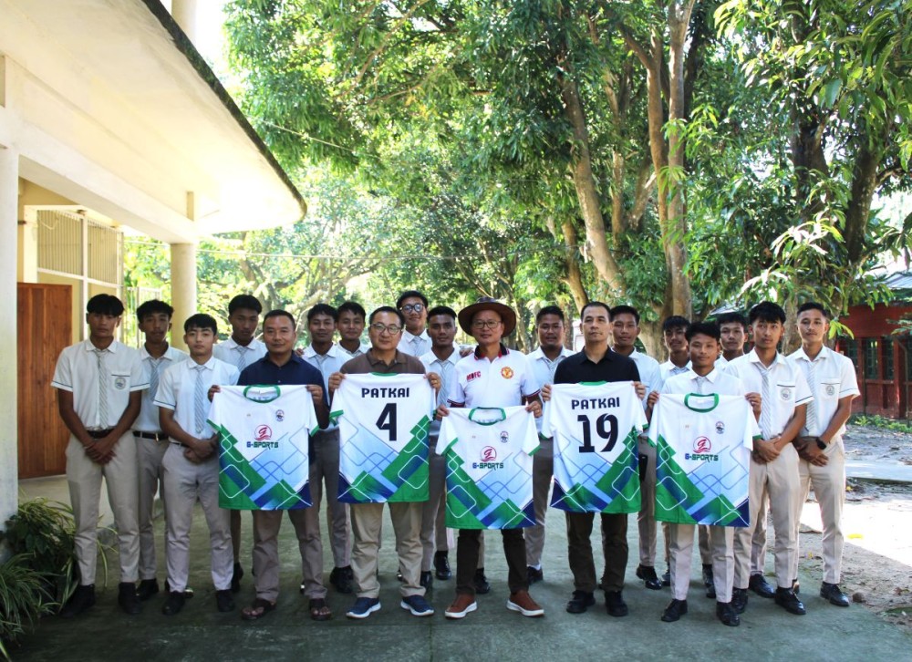 Colo Mero, Director of Life Ministries, unveiling the Patkai Christian College football jersey on campus.
